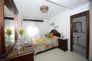 A bed or beds in a room at CASA PALACIO LAS PALOMAS