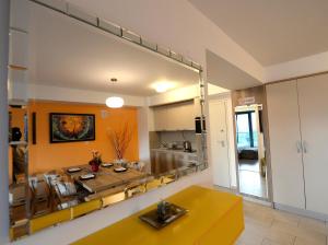 a living room with a large mirror on the wall at Diva Capitol Luxury in Skopje