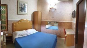 Postel nebo postele na pokoji v ubytování Hotel stranamore