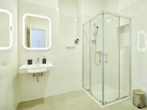 Kúpeľňa v ubytovaní Porta Downtown Apartments by Irundo + 25 fotografií