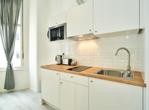 Kuchyňa alebo kuchynka v ubytovaní Porta Downtown Apartments by Irundo