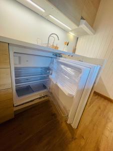 Kuchyň nebo kuchyňský kout v ubytování Studio avec sauna - 300m des pistes