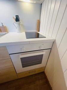 Kuchyň nebo kuchyňský kout v ubytování Studio avec sauna - 300m des pistes
