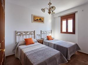 Postel nebo postele na pokoji v ubytování Casa Carrillo