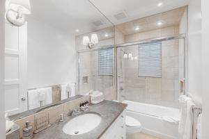 a bathroom with a sink and a tub and a toilet at Telluride Memories in Telluride