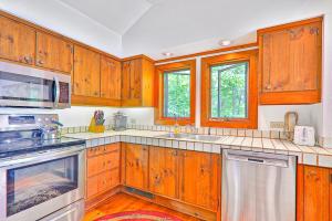 a kitchen with wooden cabinets and stainless steel appliances at 1477 Salt Ash Road in Plymouth