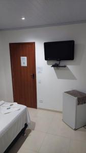 TV a/nebo společenská místnost v ubytování Pousada Vila Mar
