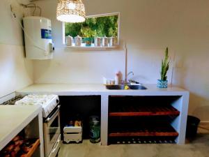a kitchen with a counter with a sink and a sink at Delta Tigre in Tigre