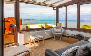 a living room with a view of the ocean at Sea-Prize View in Colwyn Bay