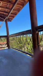 a view from the inside of a porch with a fence at Pousada Azul Blue in Amontada