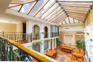 an indoorrium with tables and chairs in a building at Ayenda La Antigua in Tunja