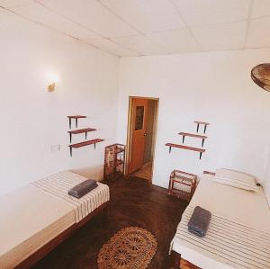 Postel nebo postele na pokoji v ubytování Lotus Surf House