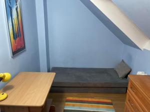 a small room with a bed and a table at Lokum u Joanny in Nowy Łupków +12 photos