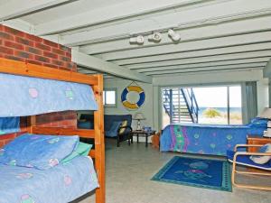 A bunk bed or bunk beds in a room at Eden On the Beach - beachside getaway
