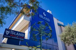 a sign on the side of a building at Island Boutique Hotel in Rhodes Town