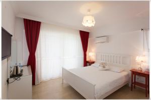 Postel nebo postele na pokoji v ubytování Ayka Hotel