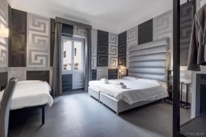 Postel nebo postele na pokoji v ubytování Hotel Spagna