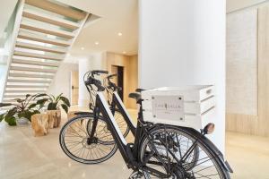 a bike parked in a room with boxes on it at Can Salia in San Antonio Bay