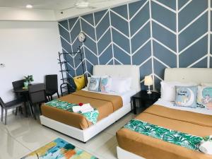 Studio I-Soho D'Gunduls Homestay by DGH I-CITY客房内的一张或多张床位