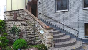 a stone stairway leading up to a house at Ferienwohnung am Kurpark in Bad Münder am Deister