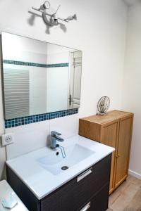 a bathroom with a sink and a mirror at LE GALLI en plein cœur de Sanary in Sanary-sur-Mer +20 photos