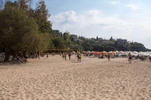 a group of people playing soccer on a beach at Remvi Hotel - Apartments in Stoupa