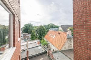- une vue sur la ville depuis un bâtiment en briques dans l'établissement VilvoCity Center, à Vilvorde