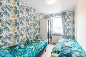 Postel nebo postele na pokoji v ubytování VilvoCity Center