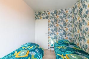 Postel nebo postele na pokoji v ubytování VilvoCity Center