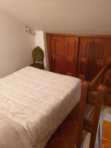 Postel nebo postele na pokoji v ubytování Lo chalet Biancaneve