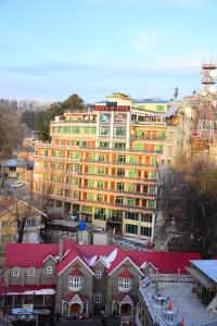a large apartment building in the middle of a city at Move-N-Pick Murree in Murree