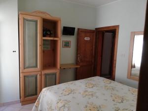 Postel nebo postele na pokoji v ubytování Anticarua B&B
