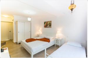 Postel nebo postele na pokoji v ubytování Ayka Hotel
