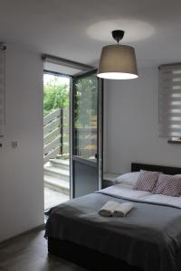 Posteľ alebo postele v izbe v ubytovaní Apartamenty Świstak Maciej Dunajczan
