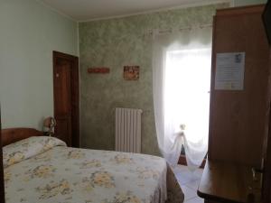 Postel nebo postele na pokoji v ubytování Anticarua B&B