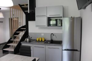 Kuchyňa alebo kuchynka v ubytovaní Apartamenty Świstak Maciej Dunajczan