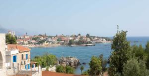a view of a large body of water with buildings at Remvi Hotel - Apartments in Stoupa