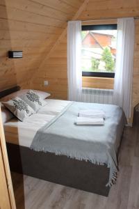 Posteľ alebo postele v izbe v ubytovaní Apartamenty Świstak Maciej Dunajczan