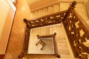a stairway with a mirror on the wall at Relais San Clemente in Perugia