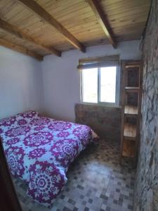 En eller flere senger på et rom på Cabañas La Rustica 6p