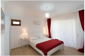 Postel nebo postele na pokoji v ubytování Ayka Hotel