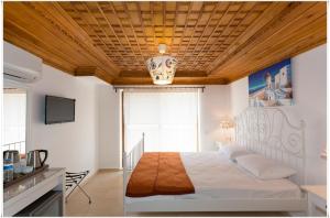 Postel nebo postele na pokoji v ubytování Ayka Hotel