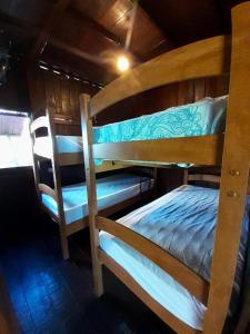 a couple of bunk beds in a room at Kite Point Atins in Atins