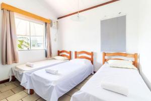 Cama o camas de una habitación en GB40 Casa 4 Suítes a 200m da Praia - Guarajuba