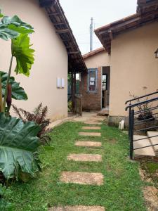 a stone walkway in front of a house at Pousada Sossego in Lavras Novas
