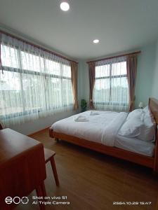 Postel nebo postele na pokoji v ubytování Hi Q View Pua
