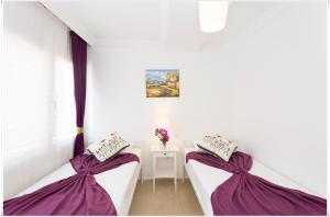 Postel nebo postele na pokoji v ubytování Ayka Hotel