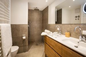 a bathroom with a sink and a toilet at Alpin Supreme in Oberstdorf +42 photos