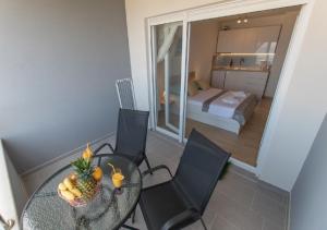 Rúm í herbergi á Seaview apartments Oscar
