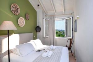 Posteľ alebo postele v izbe v ubytovaní Hammock House